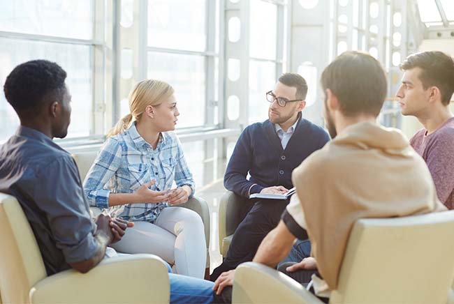 co-workers talking in a group